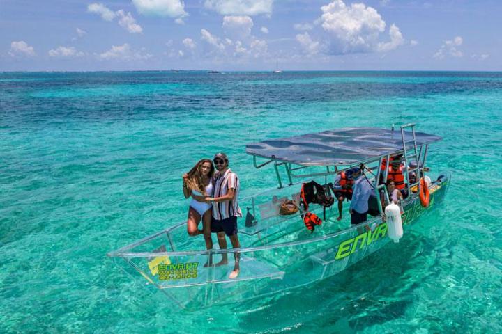 a group of people standing next to a body of water