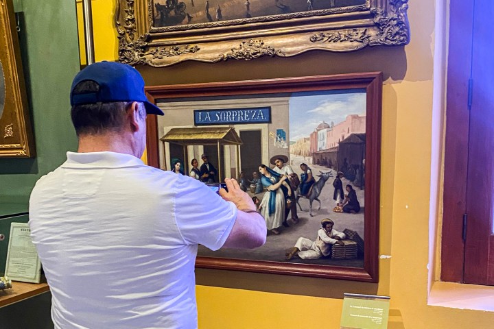 a man standing in front of a mirror posing for the camera