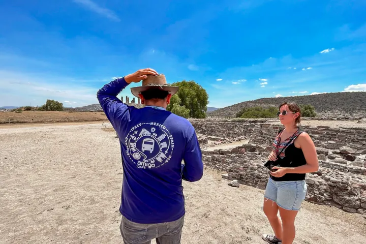 a person standing on top of a dirt field