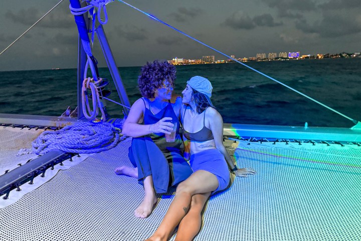 a person sitting on a boat in the water