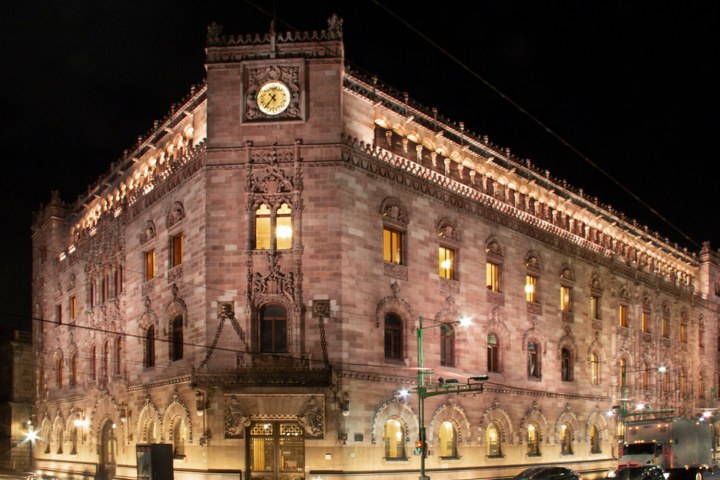 a large clock tower towering over a city