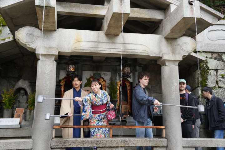 a group of people standing in front of a building