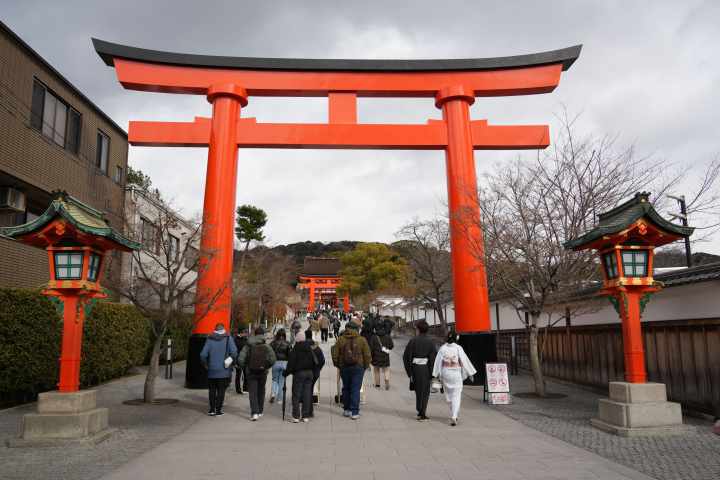 a group of people standing in front of a building