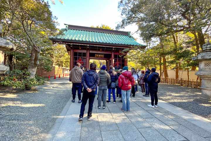 a group of people walking down the street