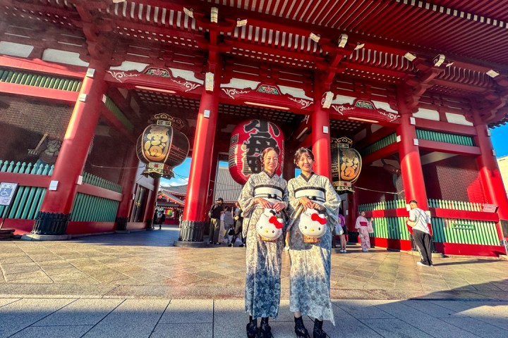 a group of people sitting at a train station