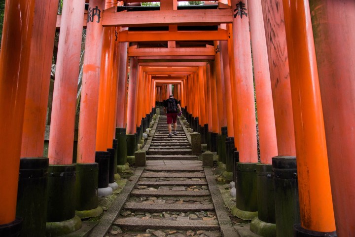 an orange bench in front of Fushimi Inari-taisha