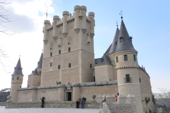 a castle sitting on the side of a building