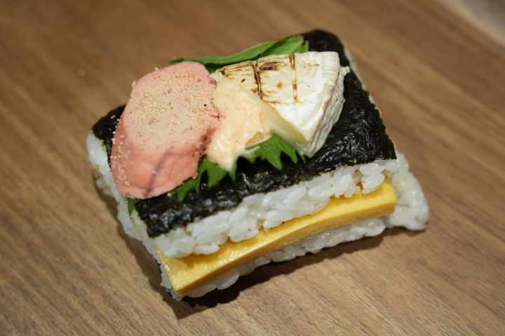 a piece of cake sitting on top of a wooden floor