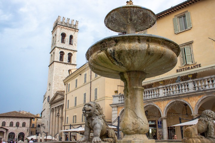 a large stone statue in front of a building