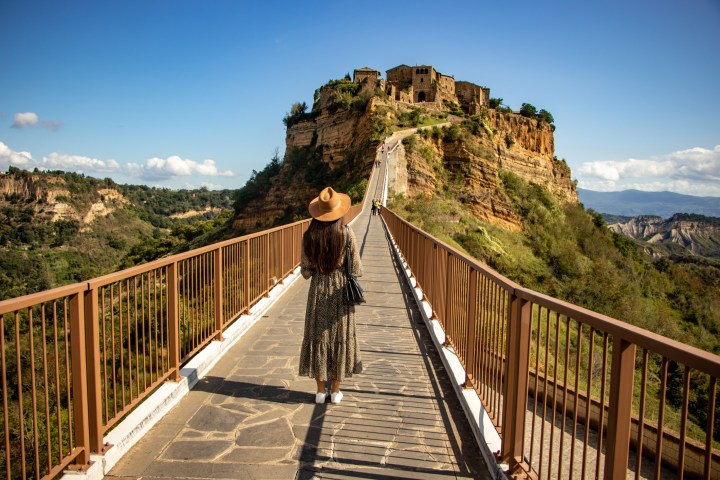 a person walking across a bridge