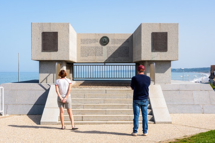 a group of people standing in front of a building