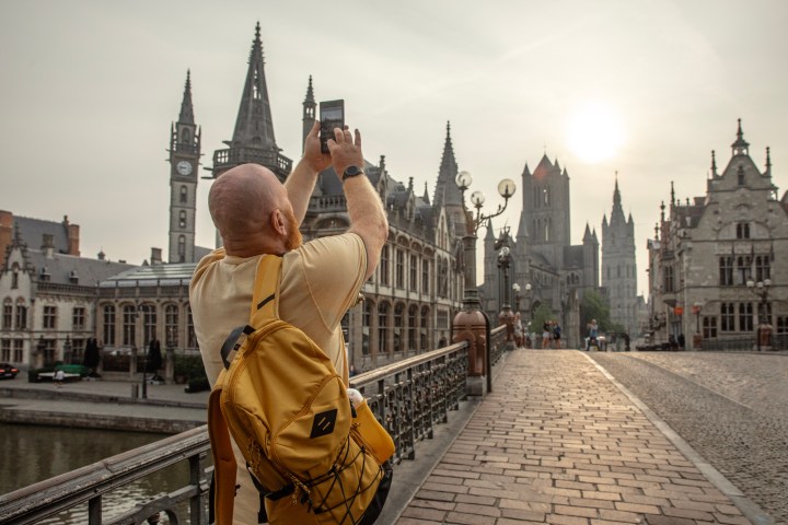 a man standing in front of a building