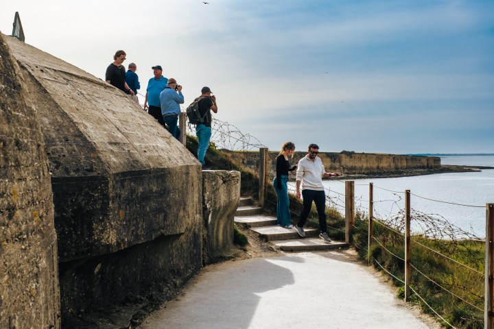 a man riding a skateboard down the side of a ramp