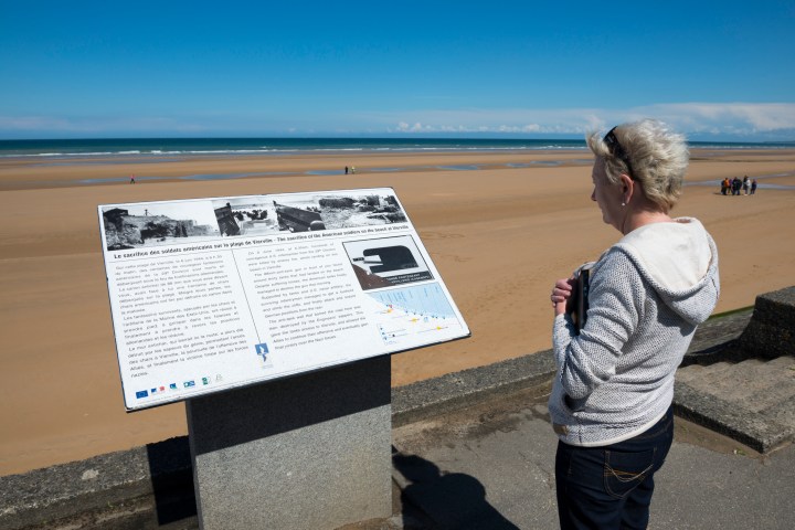 a person standing in front of a beach