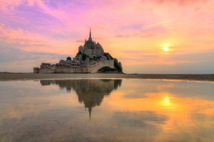 Mont Saint-Michel over a body of water