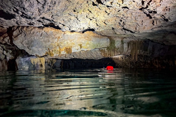 a fire hydrant on the side of a river
