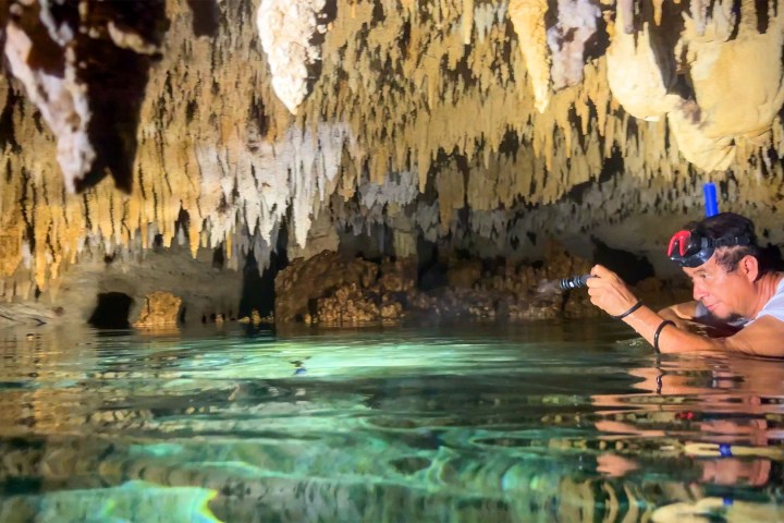a man that is standing in the water