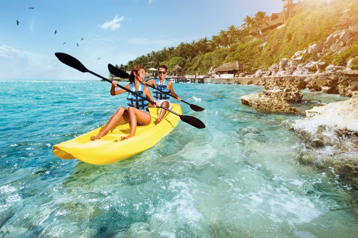 a person riding a surf board on a body of water