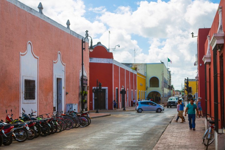 a group of people walking in front of a building