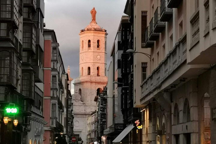 a group of people walking on a city street
